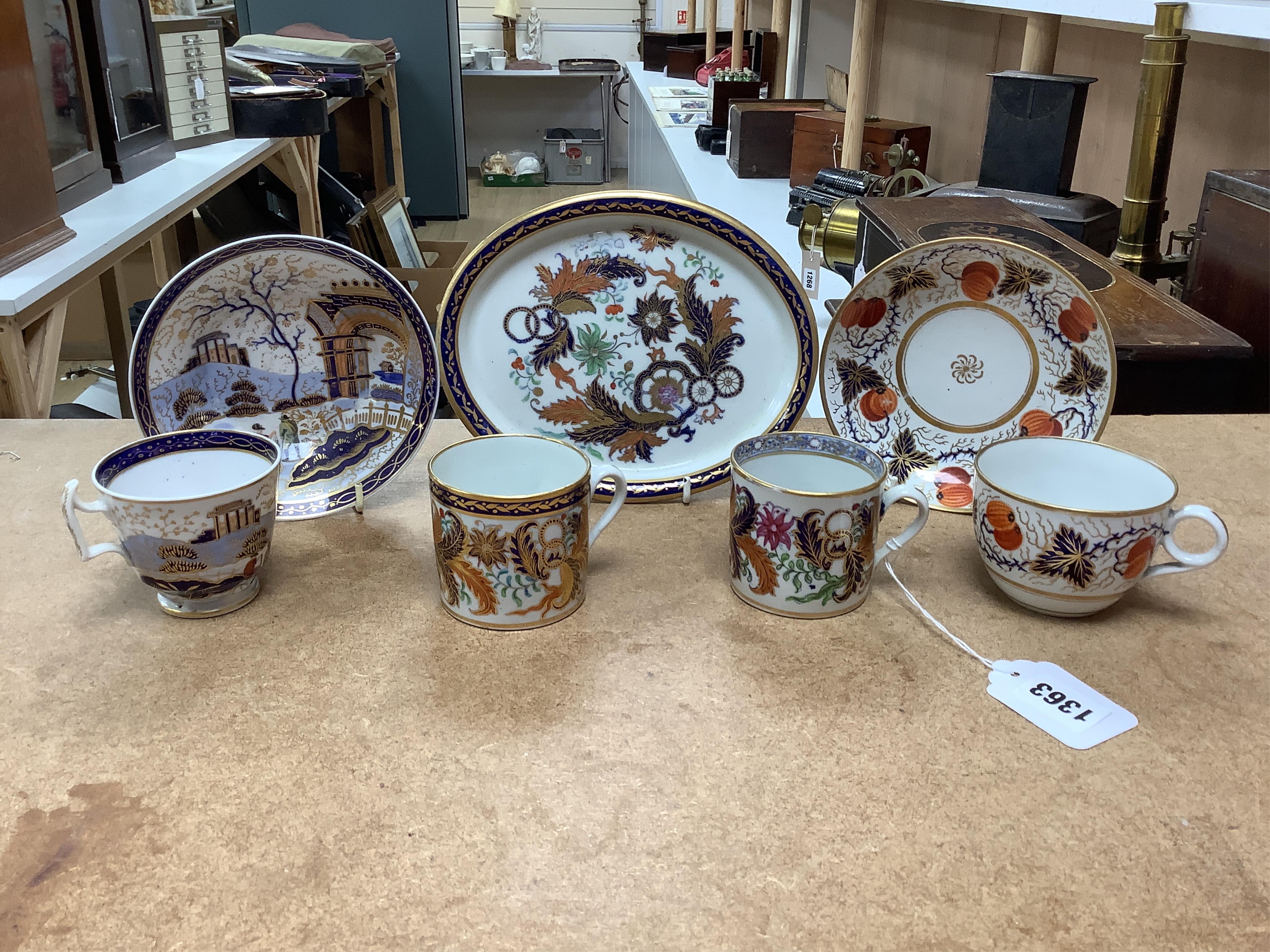 Six mixed English 1800-1820 porcelain cabinet cups and saucers, three similar coffee cans and saucers, a matching spoon stand and two coffee cans, a saucer dish, coffee can plus saucer and a tea bowl and matching saucer